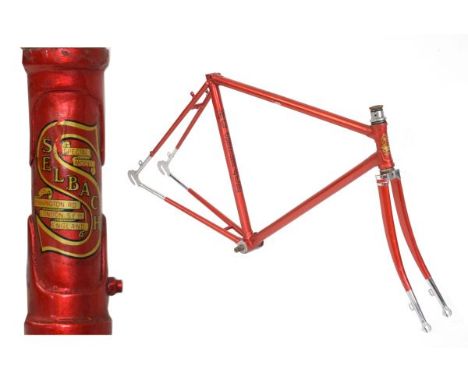 Vintage steel racing cycle frame in metallic red, bearing M.G Selbach red and black transfers with red, black and gold transf