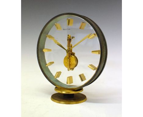 Jaeger-LeCoultre circular brass cased mantel clock having a clear glass front and back panel enclosing the visible movement, 