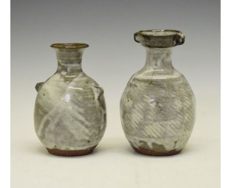 Two Janet Leach studio pottery baluster shaped vases, each having a mottled grey glaze, impressed personal and Leach Pottery 