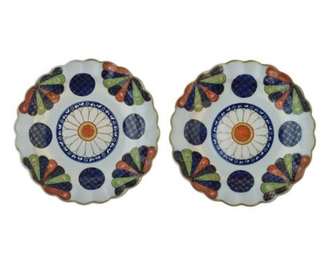 Pair of 18th Century Worcester plates, each decorated with the Fan pattern, 19.5cm diameter  Condition: One of the plates app