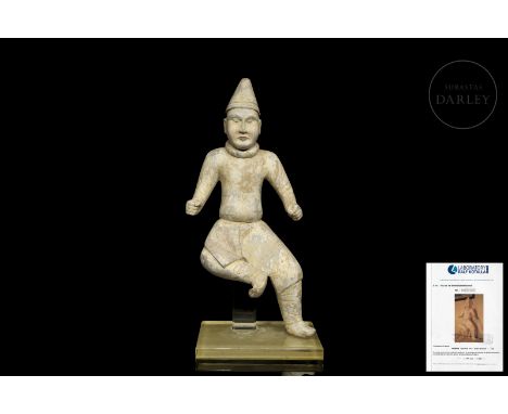 Kaolin ceramic figure with visible traces of polychromy. It shows the image of a man, with both legs bent and arms stretched 