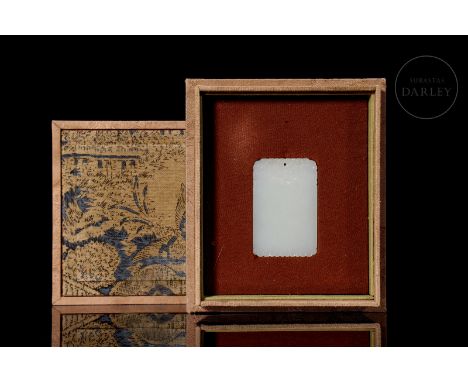 Elegant carved jade plaque from Hetian, characterized by its pristine white colour and smooth, milky texture. It is rectangul