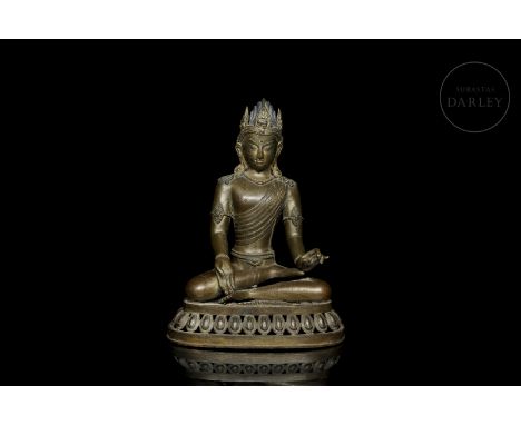 Bronze figure with relief and incised decoration. The deity is shown seated on an elliptical throne with openwork lotus petal