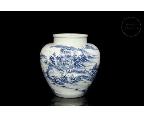 Modelled ceramic, decorated with an underglaze of cobalt-blue and white glaze. It has a narrow circular base and a rounded bo