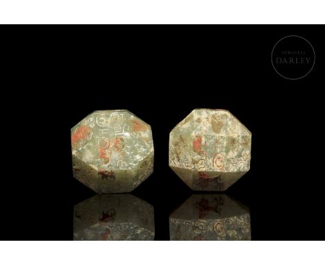 A pair of polyhedral-shaped seals carved in jade with engraved characters. On the square faces, 18 surfaces, there are seals 