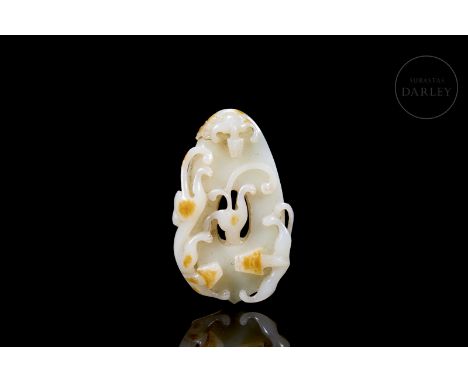 White jade with amber flecks. Carved in the form of a flat oval pendant with a central hole. Small, elongated dragons with st