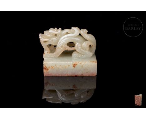 Carved white jade, subtle reddish flecks. It has a short rectangular base, on which is shown the free-standing figure of a my