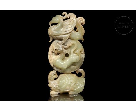 Carved jade of a light-green hue with ochre and reddish flecks. In the lower part, supporting the composition, is a large tur