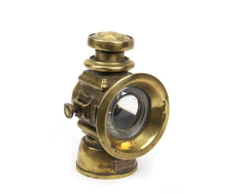 A Lucas model 524 oil illuminated sidelight,left hand light, brass bodied with side flange mount, 4 inch diameter main lend i