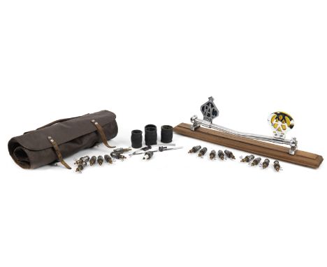 A mixed lot of automobilia,comprising an RAC and AA badge mounted on a badge bar on wooden base, a 1960s style tool-roll, a b