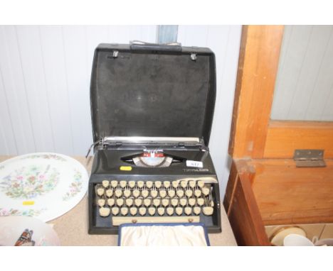 An Adler typewriter in carrying case