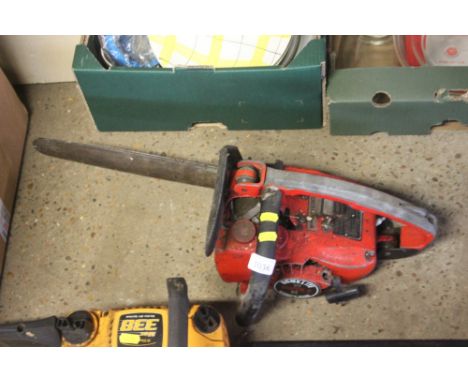 A Homelight petrol chainsaw lacking chain 
