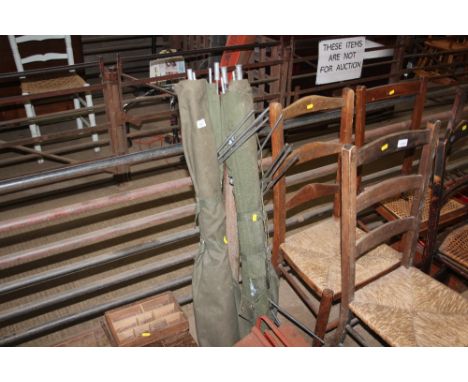 Two army style camp beds