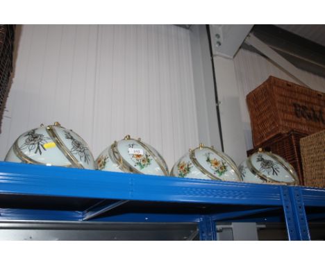 Four brass and glass light shades 