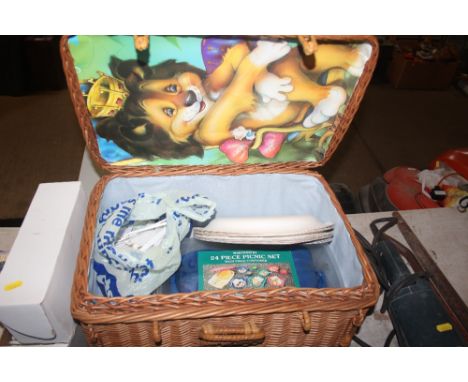 A wicker picnic hamper and contents