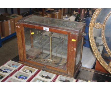 A set of chemist scales in case (AF)
