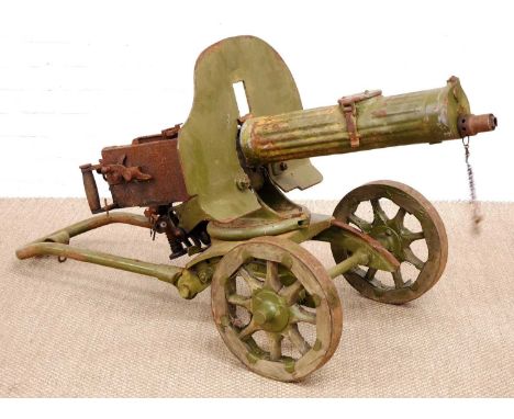 Deactivated Maxim 7.62 M.1910 belt fed heavy machine gun on carriage, with 28inch barrel surrounded by water cooled shroud, s