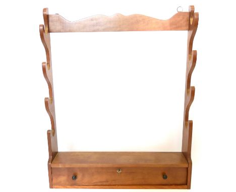Gun rack with provision for four guns, and drawer to base containing two powder flasks and a shot flask. 78cm x 62cm