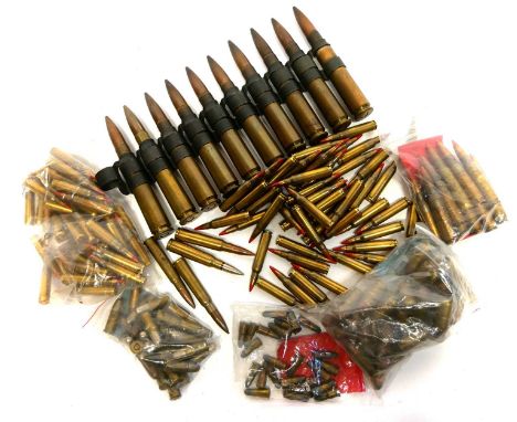 Mixed ammunition, to include a belt of ten 12.7mm rounds, ninety seven 5.56 tracer rounds, twenty seven WWII era .380 rounds,