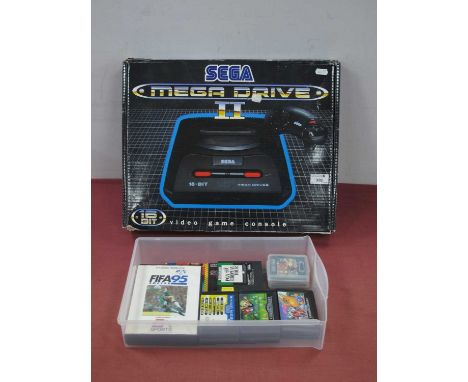 A Boxed Sega Megadrive II 16-Bit Games Console, (ink/pen to power button), two controllers, literature, six Mega Drive games 