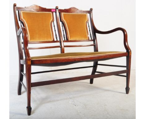 A late 19th century Victorian mahogany parlour / salon / two seater window sofa bench. The twin seat chair having carved arch