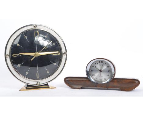 Two vintage mid century alarm clocks by Metamec and Rhythm, Japan.The Metamec example of brass and stainless steel constructi