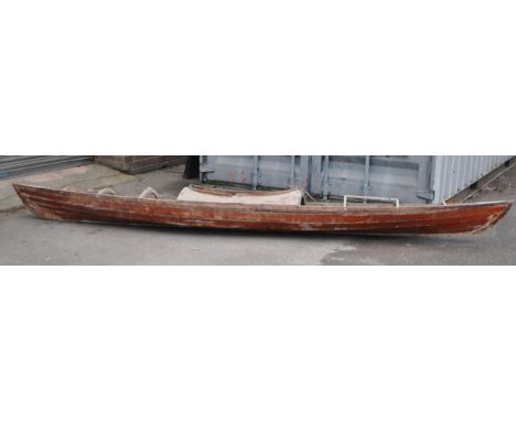 A vintage 20th century cedar wood kayak / canoe boat of typical ribbed design and construction.&nbsp; Natural wood finish. Me