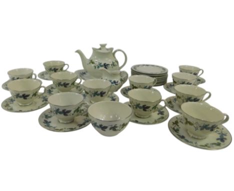 A Royal Doulton porcelain Burgundy pattern tea service, comprising teapot, milk jug, sandwich plate, sugar bowl, twelve teacu