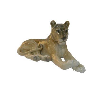 A Royal Copenhagen porcelain figure, modelled as a recumbent lioness, number 804, printed marks, 15cm high. 