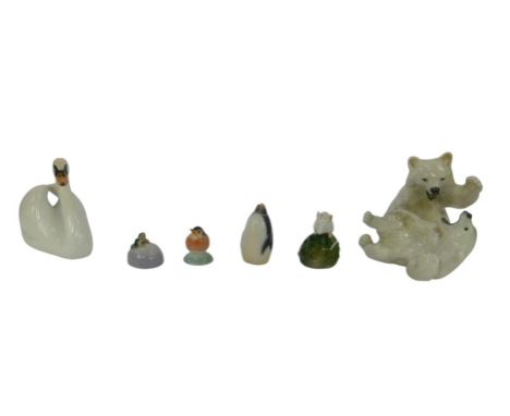 A group of Royal Copenhagen porcelain, comprising two polar bear cubs fighting, 33cm high, a swan, 11cm high, and further min