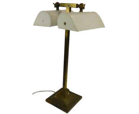 A 20thC brass table lamp, with two white painted tin shades, on a square column, on a stepped base with toggle switch, 58cm h