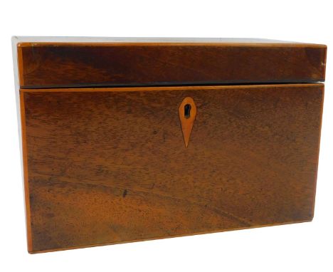 A George III mahogany tea caddy, the hinged lid with shell paterae, enclosing two divisions, 11cm high, 18cm wide, 10.5cm dee