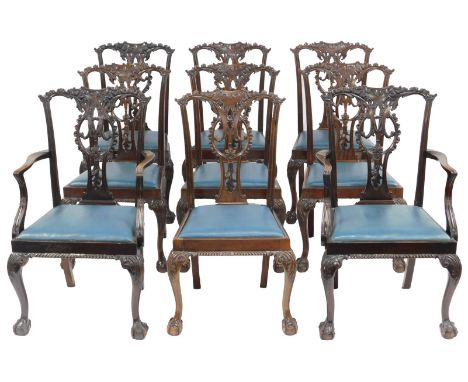 A set of nine mahogany Chippendale style dining chairs, each with a blue leatherette drop in seat, on ball and claw feet, inc