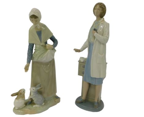 Two Nao porcelain figures, modelled as a lady feeding two rabbits, 29cm high, together with a female doctor holding a stethos