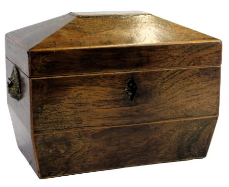 A Regency mahogany sarcophagus tea caddy, the hinged lid enclosing two sections with two brass basket handles to each side, l