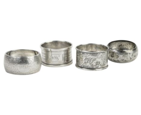 Four silver napkin rings, each of differing design, bright cut and engine engraved, 2.16oz.