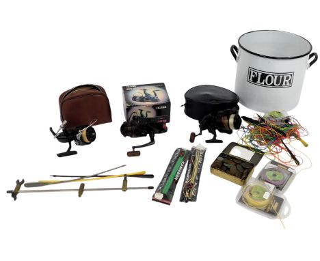 A Silstar GXB50 fixed spoon fishing reel, with bait runner, a Mitchell fixed spool reel, a Silstar GXB50 bait runner reel, et