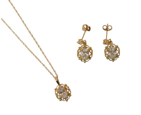 A suite of jewellery, comprising a pair of white stone drop earrings, in a pierced scroll decorated surround, claw set, and a