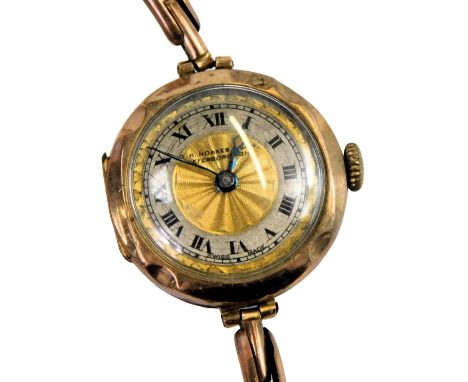 A 20thC lady's 9ct gold cased pocket watch, for G R Noakes &amp; Son, Peterborough, circular gilt engine turned dial, with si