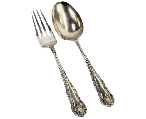 A George V silver christening set, comprising fork and spoon, each handle decorated with a roundel with a part gadrooned bord