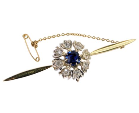 A sapphire and diamond bar brooch, in a floral design, the cushion cut sapphire in a surround of eight rose cut diamonds, in 