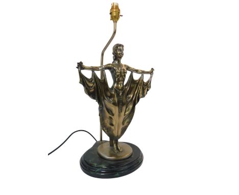 A 20thC resin table lamp, in a metal finish, depicting a scantily clad flapper style girl, on a simulated marble base, 51cm h