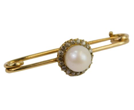 A cultured pearl brooch, in a surround of diamonds, on a safety pin mount, yellow metal, unmarked, 3.3g.