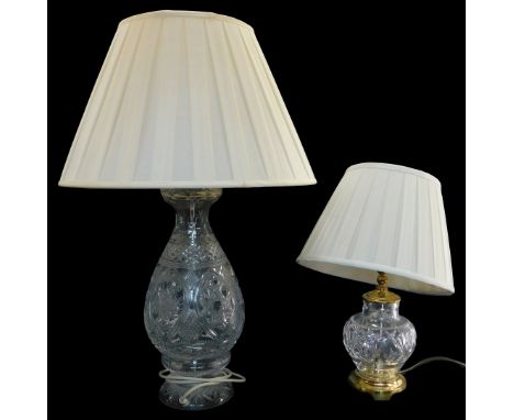 A cut glass table lamp, of baluster form, on a circular base, with shade, 71cm high overall, and another, 46cm high overall.W