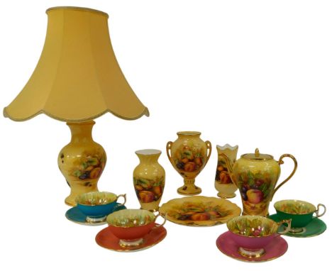 A group of Aynsley Orchard Gold porcelain, comprising a coffee pot, a twin handled vase, table lamp and shade, plate, four te