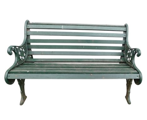 A garden bench, with green painted cast iron end supports, and a wooden slatted seat and back, 125cm wide.