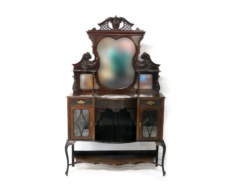 Victorian mahogany salon cabinet, circa 1890, shaped triple mirrored back carved with cornucopia and with two small shelves, 