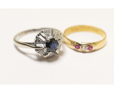 Sapphire and diamond cluster ring, in 18ct white gold, size K, gross weight approx. 3.9g; also a 22ct gold wedding ring, late