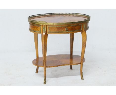 French kingwood oval silver table, early to mid 20th Century, the brass galleried oval top with quarter veneers and with a si