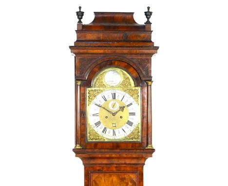 George II walnut longcase clock by William Winrow, London, circa 1730, the hood having a stepped caddy top with two urn finia